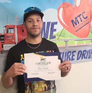 Rick White standing with certificate